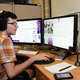 Illustration for article titled Coworker With Two Computer Screens Not Fucking Around